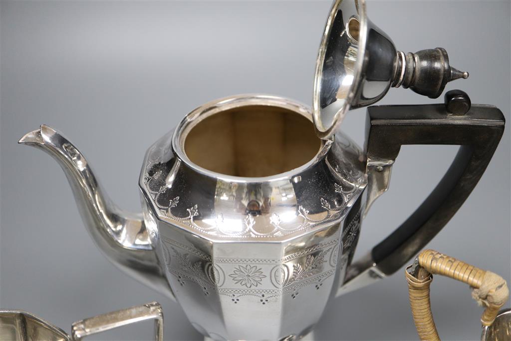 An Edwardian engraved silver three piece pedestal coffee set by James Deakin & Sons, Sheffield, 1904,
